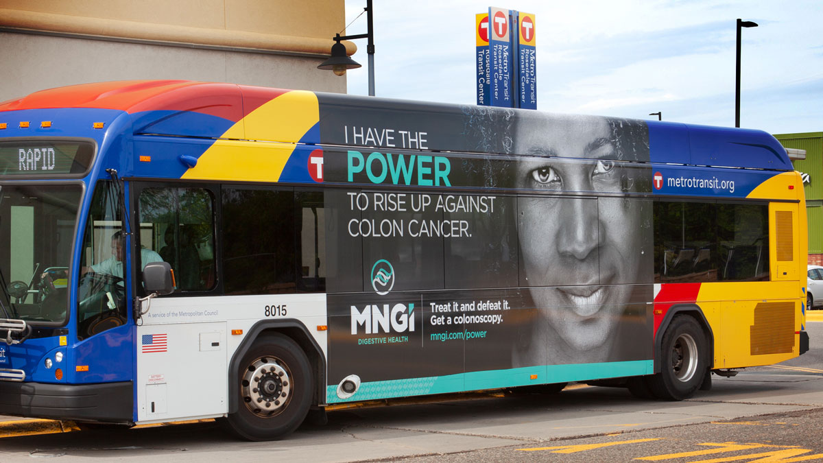 A Metro Transit bus wrapped in MNGI Digestive Health's colon cancer screening campaign