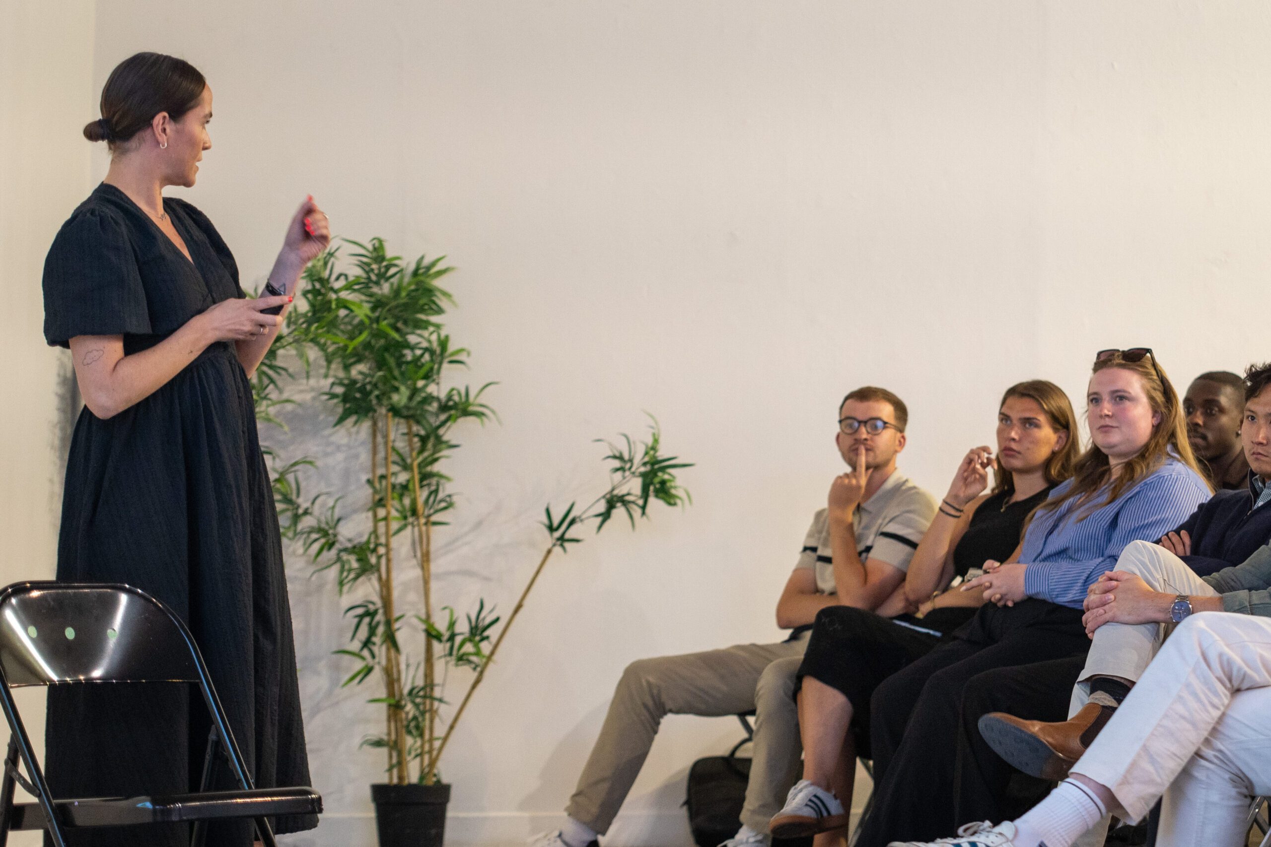 Clare Cooper speaking to seated colleagues at Levin London’s summer conference