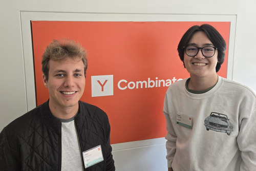 Lewis Polansky and Edgar Babajanyan standing in front of a Y Combinator sign