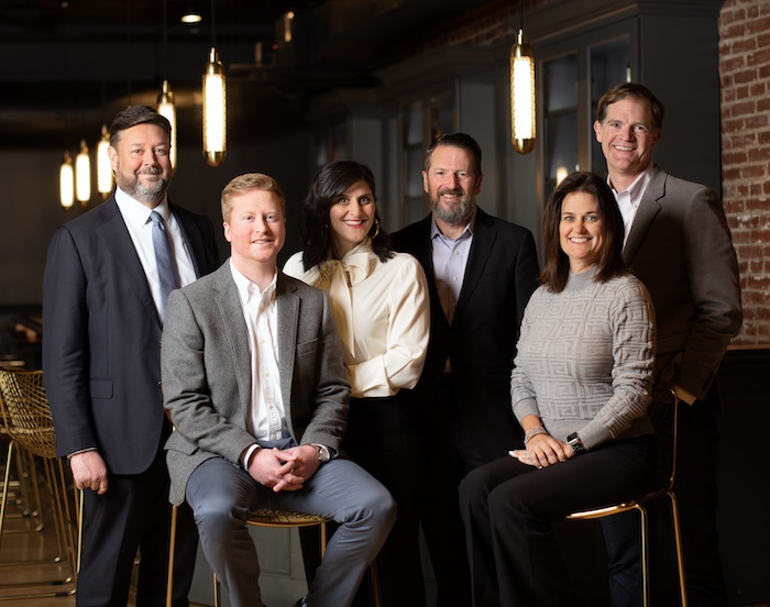 Doe-Anderson’s 2023 leadership team, with Leyla Touma Dailey standing at the center in a cream blouse