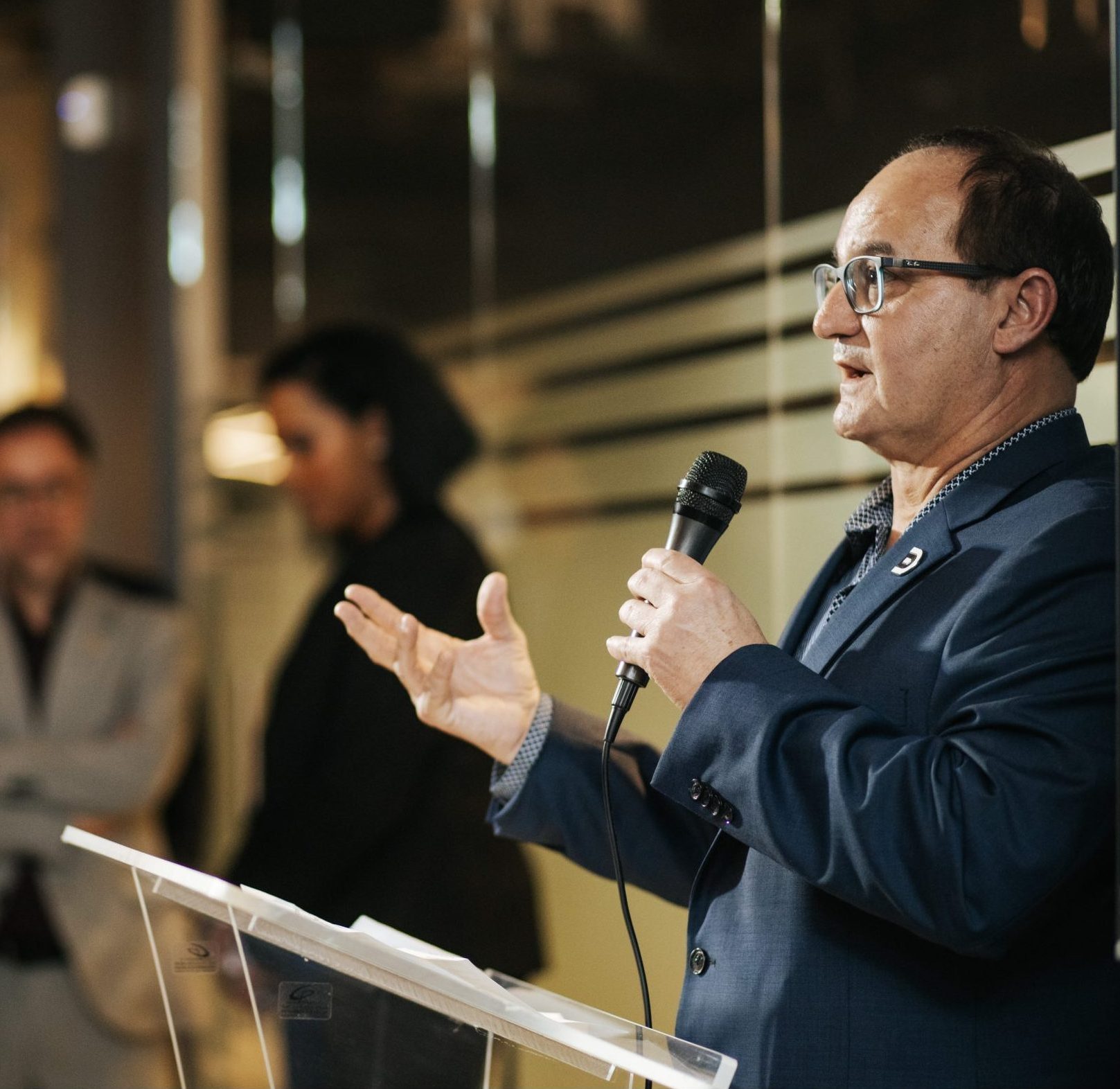 A speaker with a microphone at a Digital Domain event