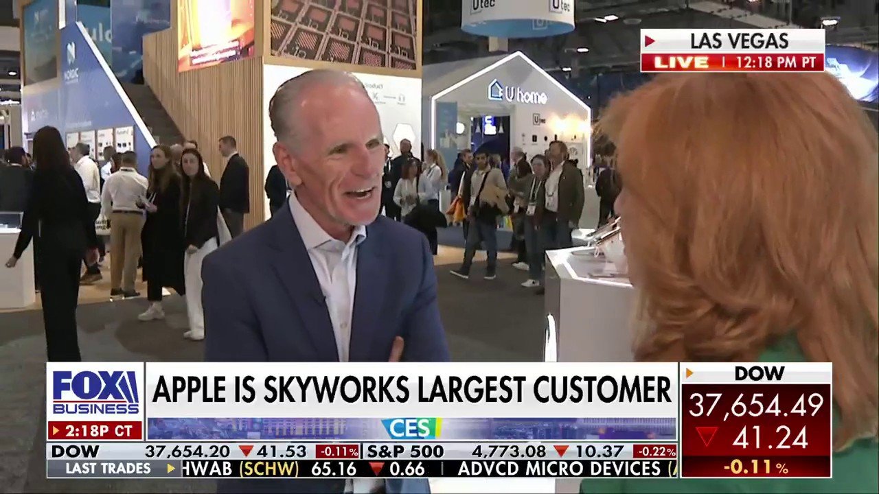 Liam Griffin speaking with a Fox Business interviewer on the CES exhibition floor in Las Vegas