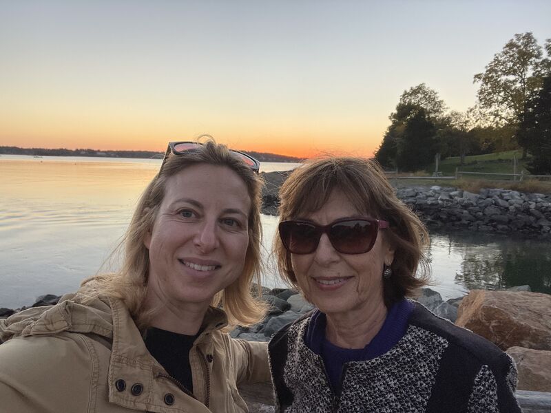 Liat Primor and her mother together beside the water at sunset