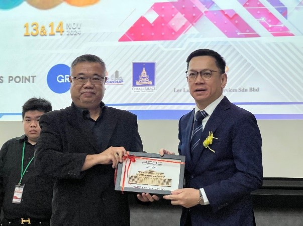 Liaw Choon Liang, on the right, receiving a presentation at the ASEAN Social Business Conference in November 2024.