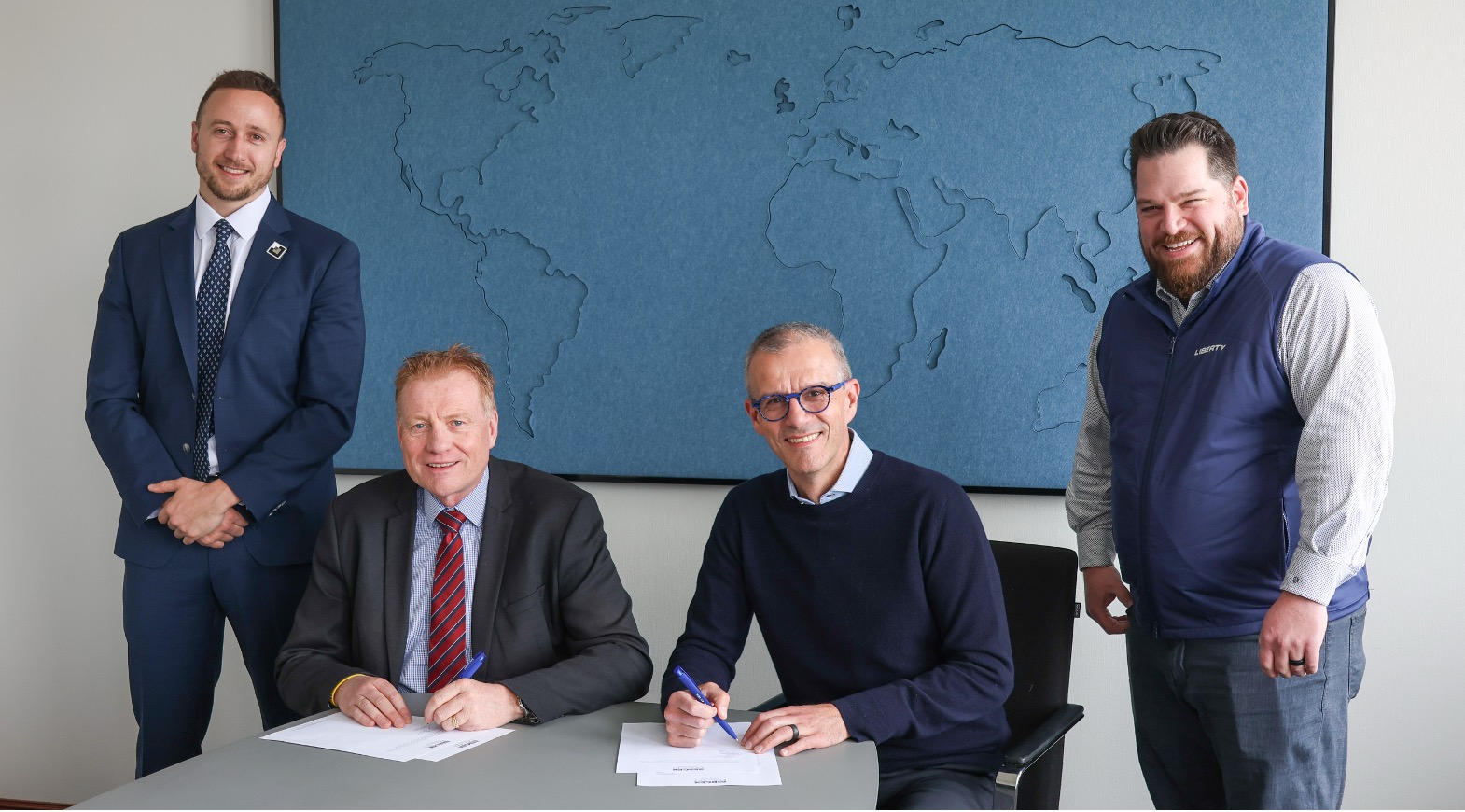 Bergen Engines and Liberty representatives, including Ron Gusek, mark their power generation agreement