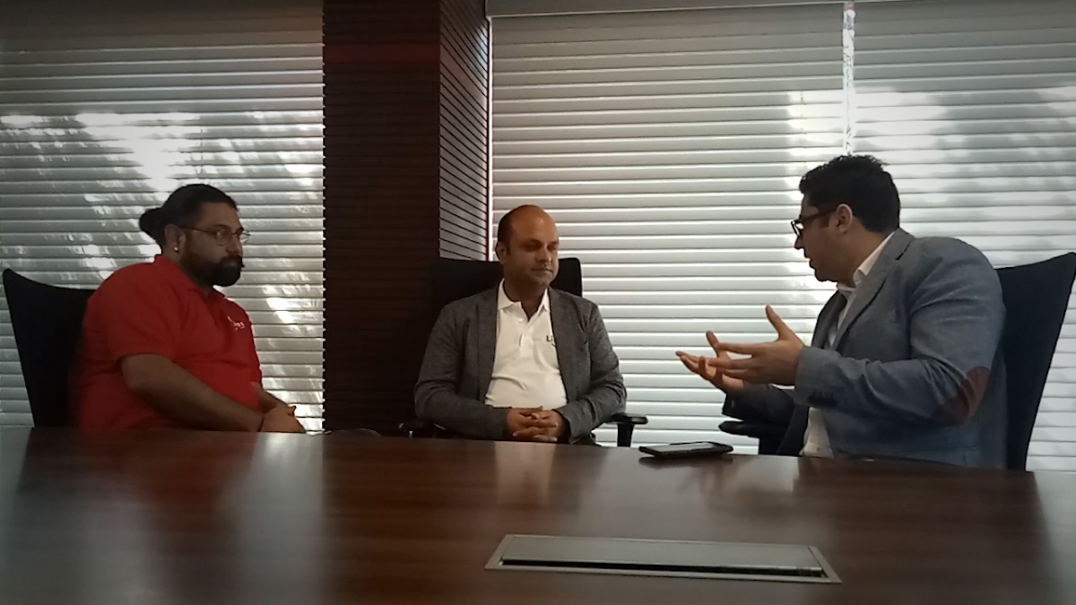 Licious founders speaking with an interviewer around a conference table