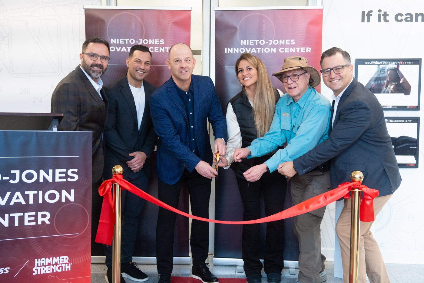 Company leaders, Gary Jones, and members of Augie Nieto’s family cutting the innovation center ribbon