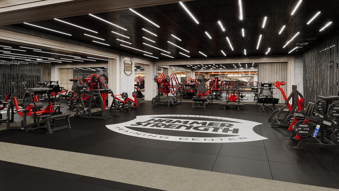 A spacious training room filled with red and black Hammer Strength machines