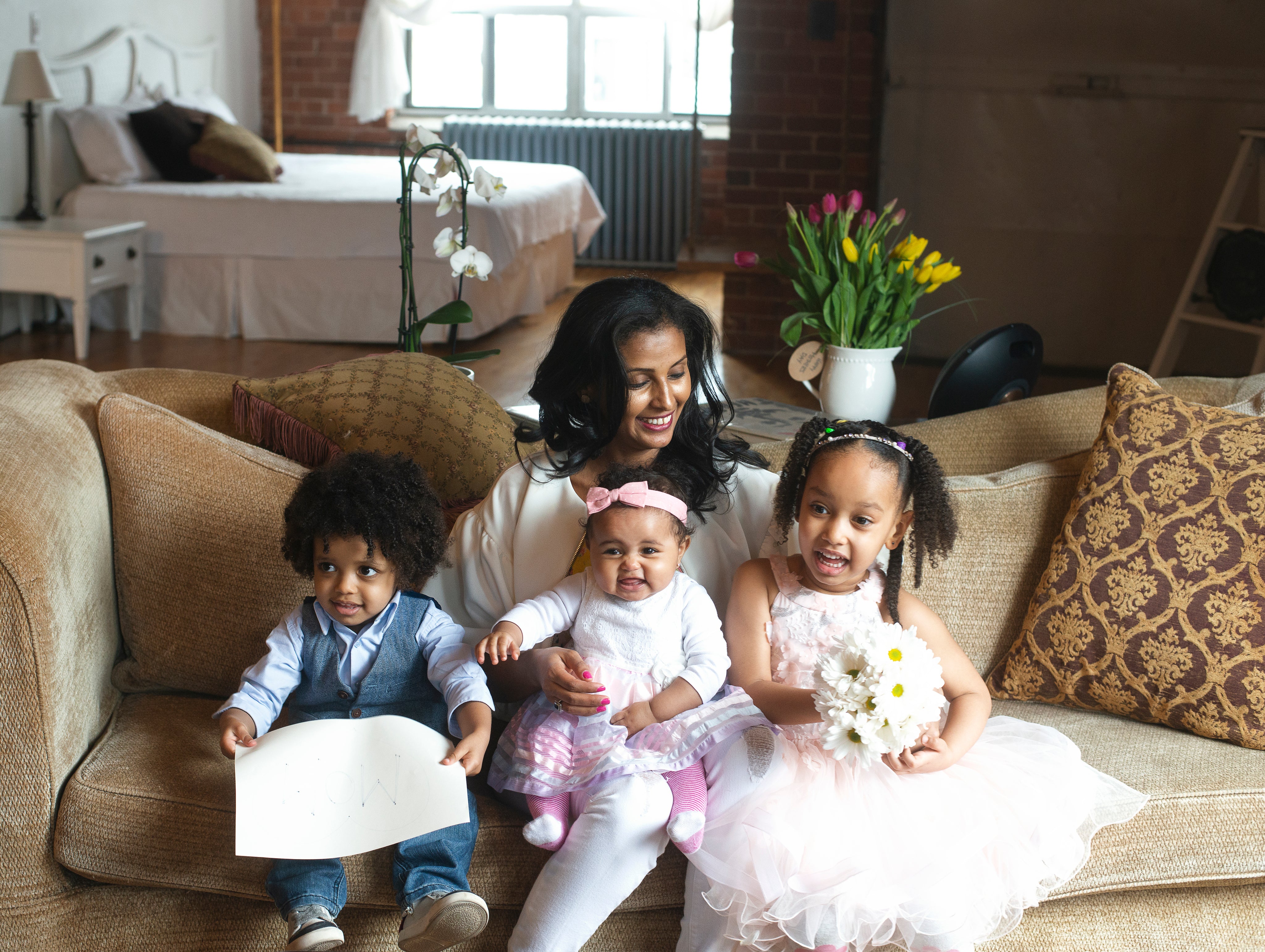 A family together outdoors, dressed up