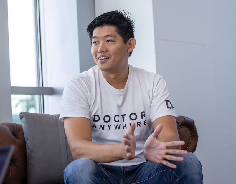 Lim Wai Mun speaking while seated in the Doctor Anywhere office