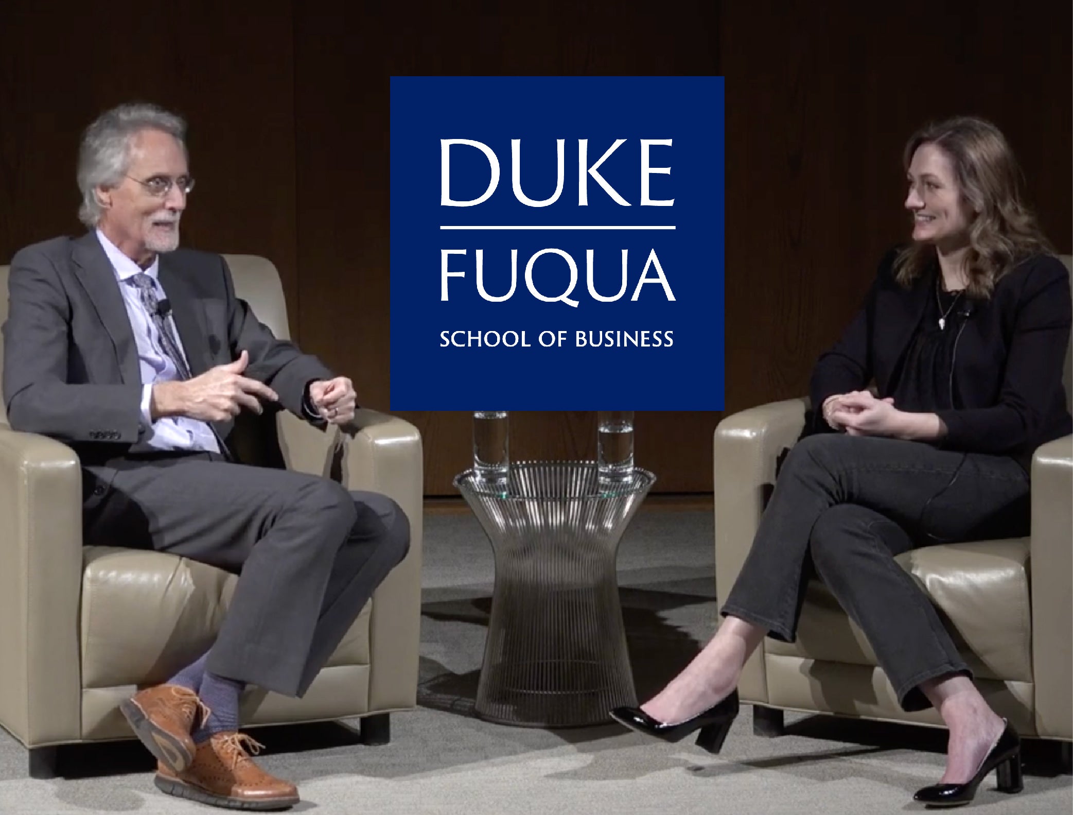 Bill Boulding and Linda Rendle seated in conversation at Duke’s Fuqua School of Business