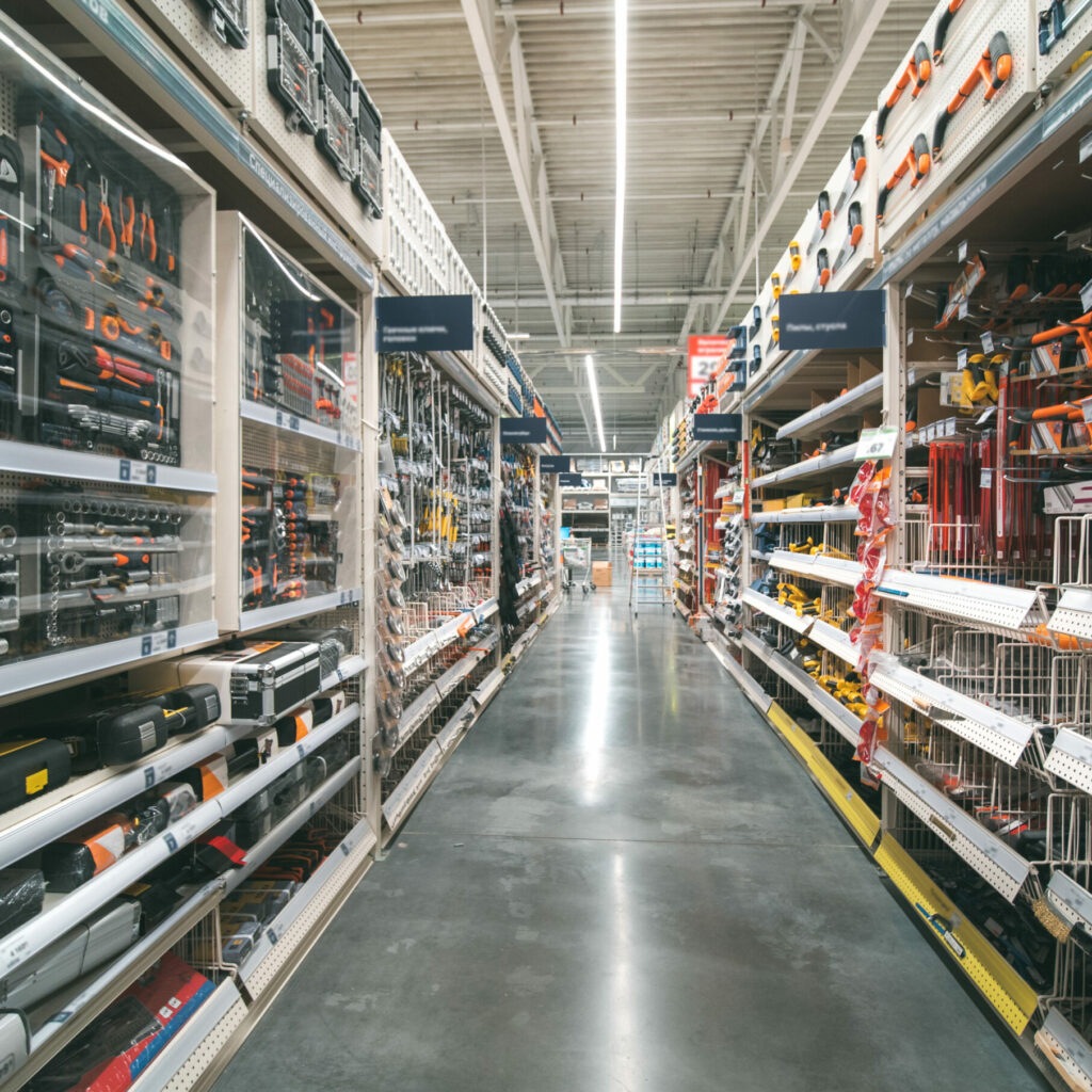 A building supply store aisle lined with tools and equipment