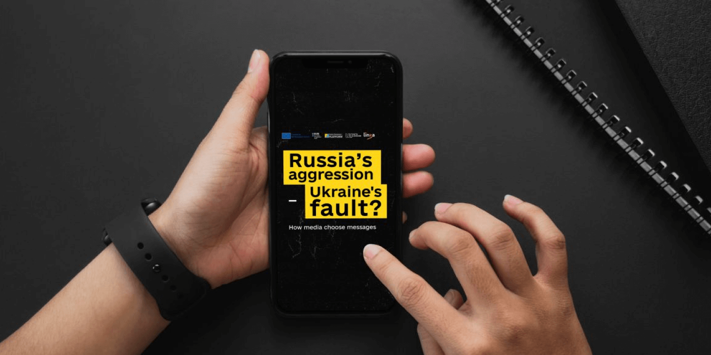 A smartphone displaying linza and WithUkraine's media language campaign