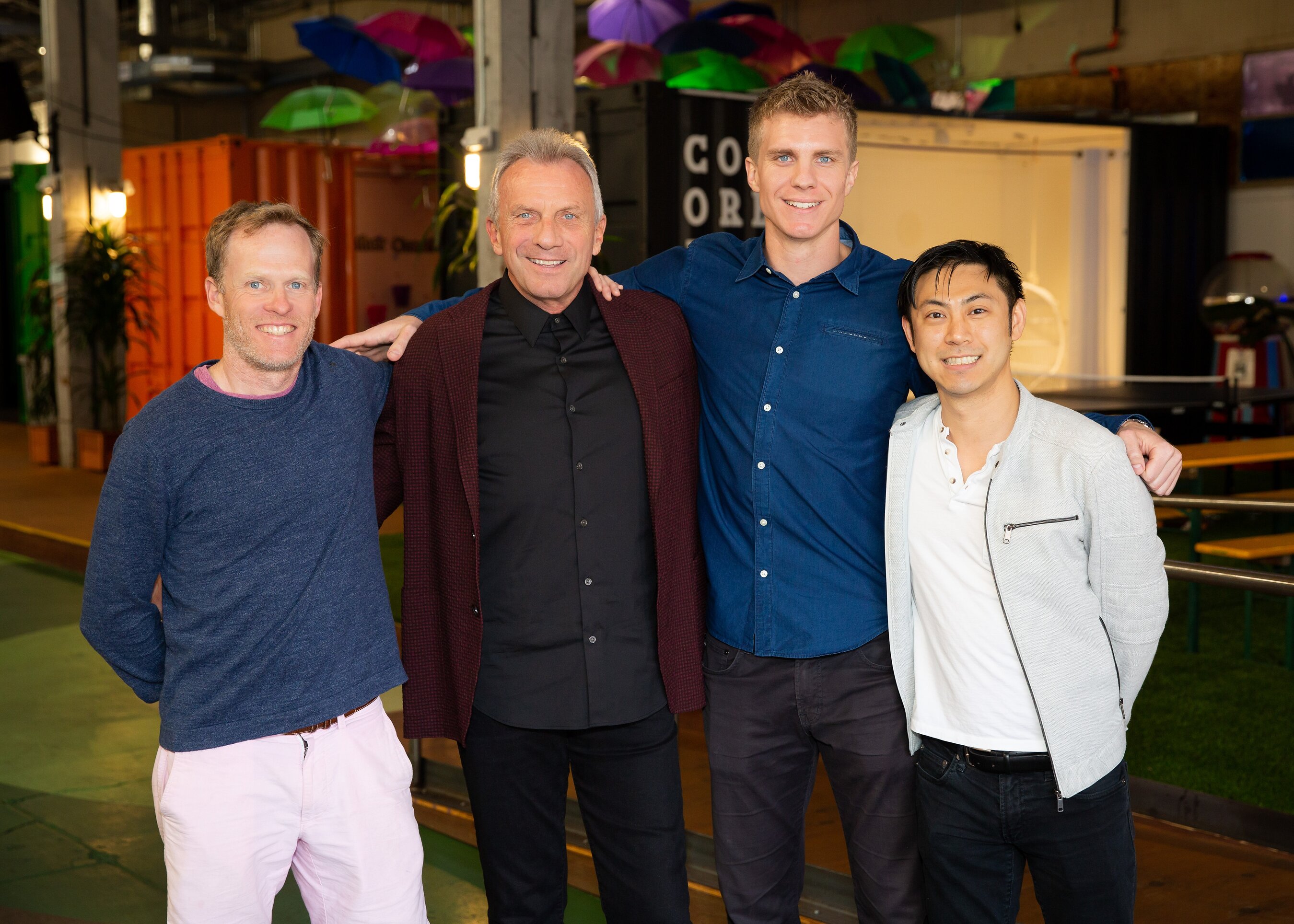 Mike Miller, Joe Montana, Nate Montana and Michael Ma standing together in the firm’s 2022 press photograph