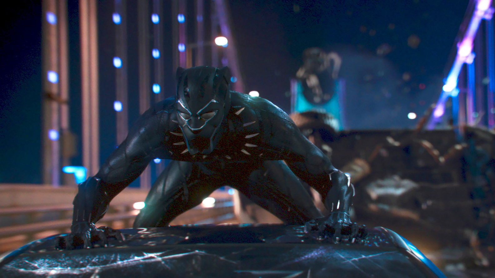 Black Panther crouches on a vehicle in a night action scene