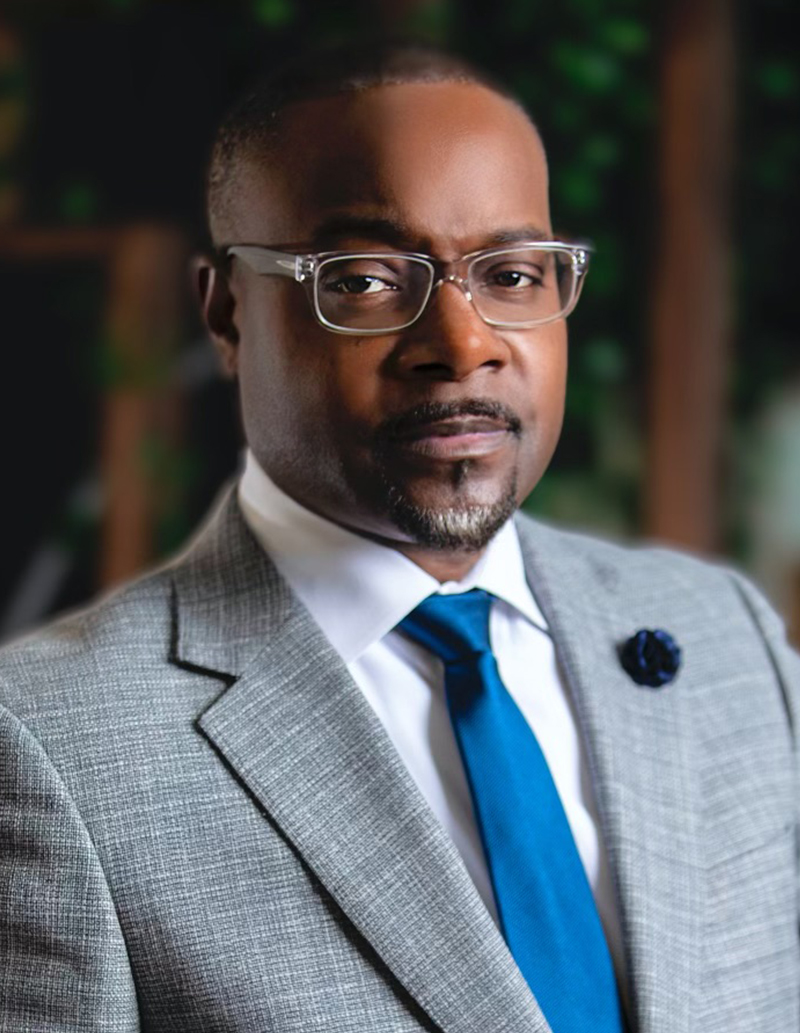 LIQUID SOUL founder Tirrell D. Whittley in a gray suit and blue tie