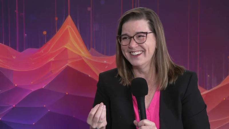 Lisa Chen speaking onstage during an interview at the 2024 Phocuswright Conference