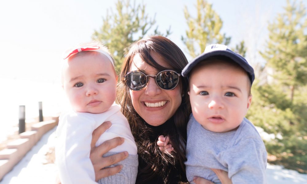 Lisa Jammal smiling outdoors with her twins