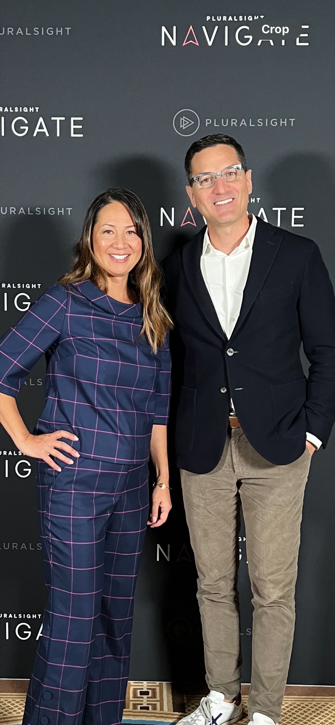 Lisa Luscap standing with Guy Raz at Pluralsight Navigate
