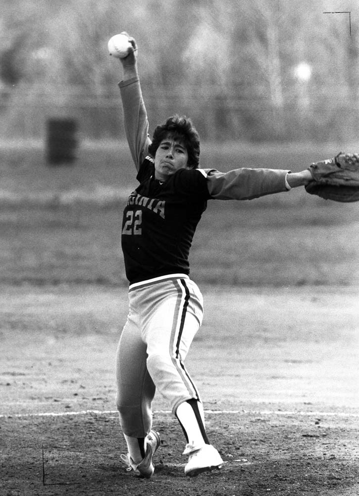 Archival black-and-white photograph of Lisa Palmer pitching for Virginia