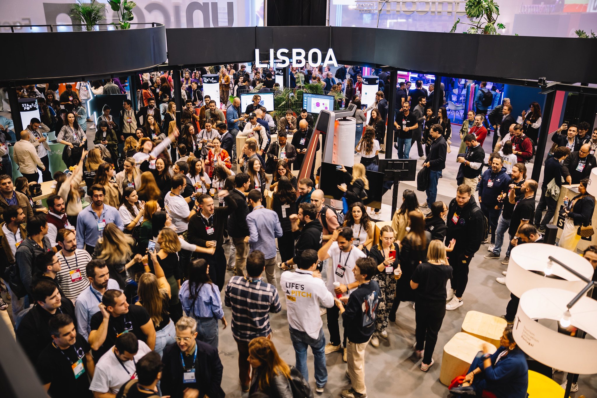 Entrepreneurs meeting around the Startup Portugal and Lisboa booth at Web Summit