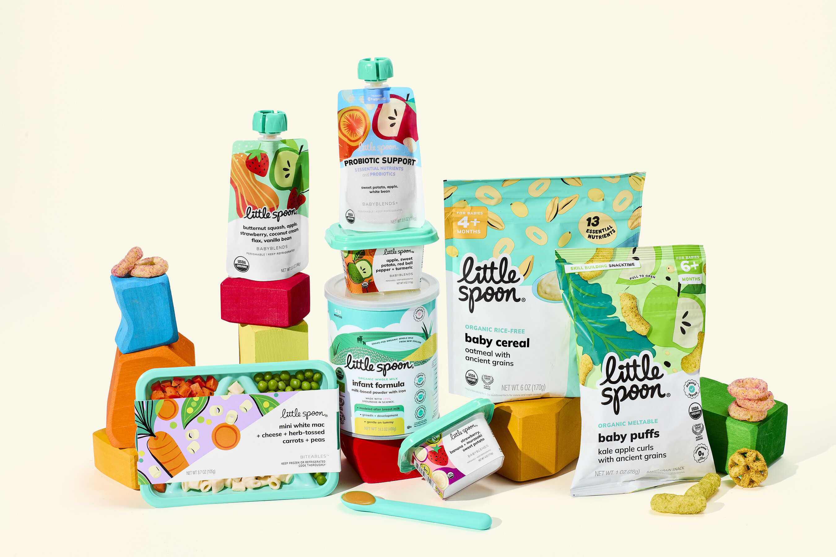 Little Spoon infant formula, purées, finger foods, cereal and snacks arranged together