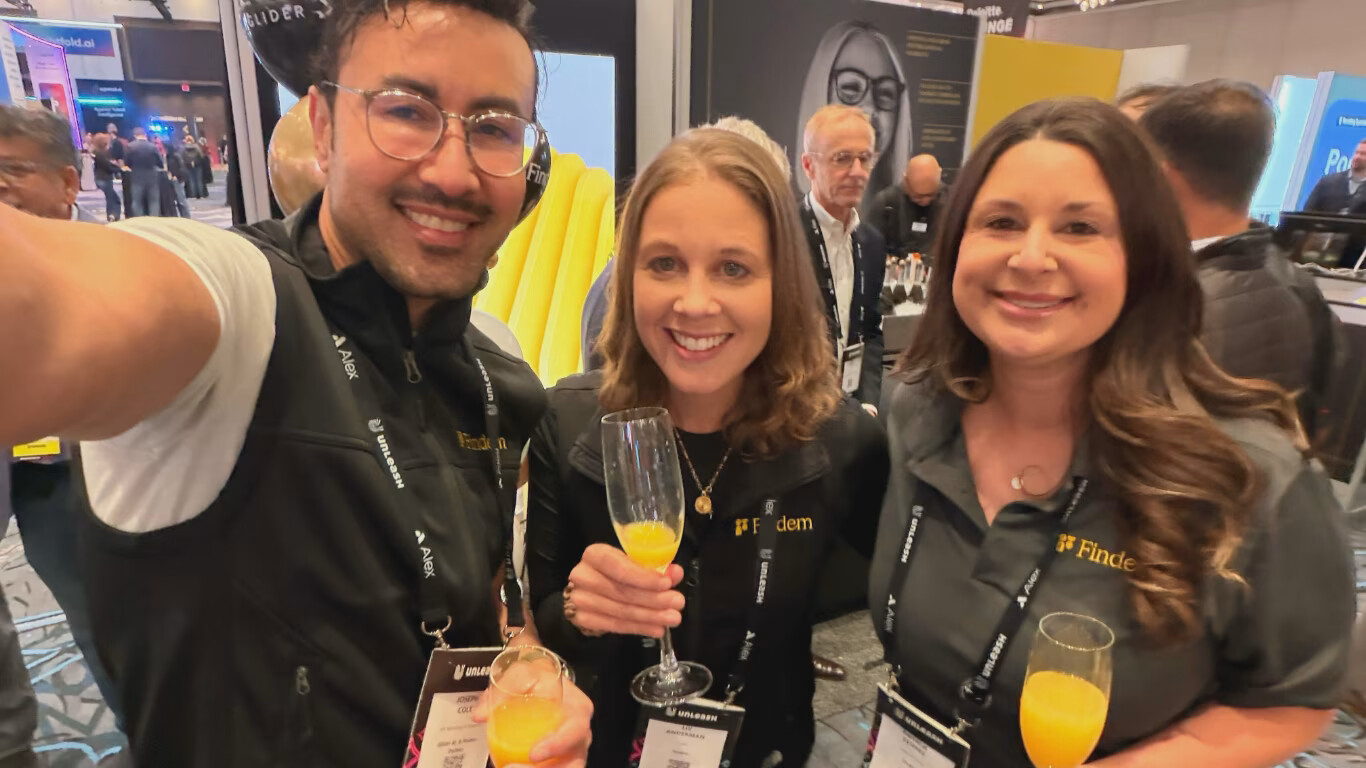 Joseph Cole, Liv Anderman and Natalie Stones at the Findem booth during UNLEASH 2026