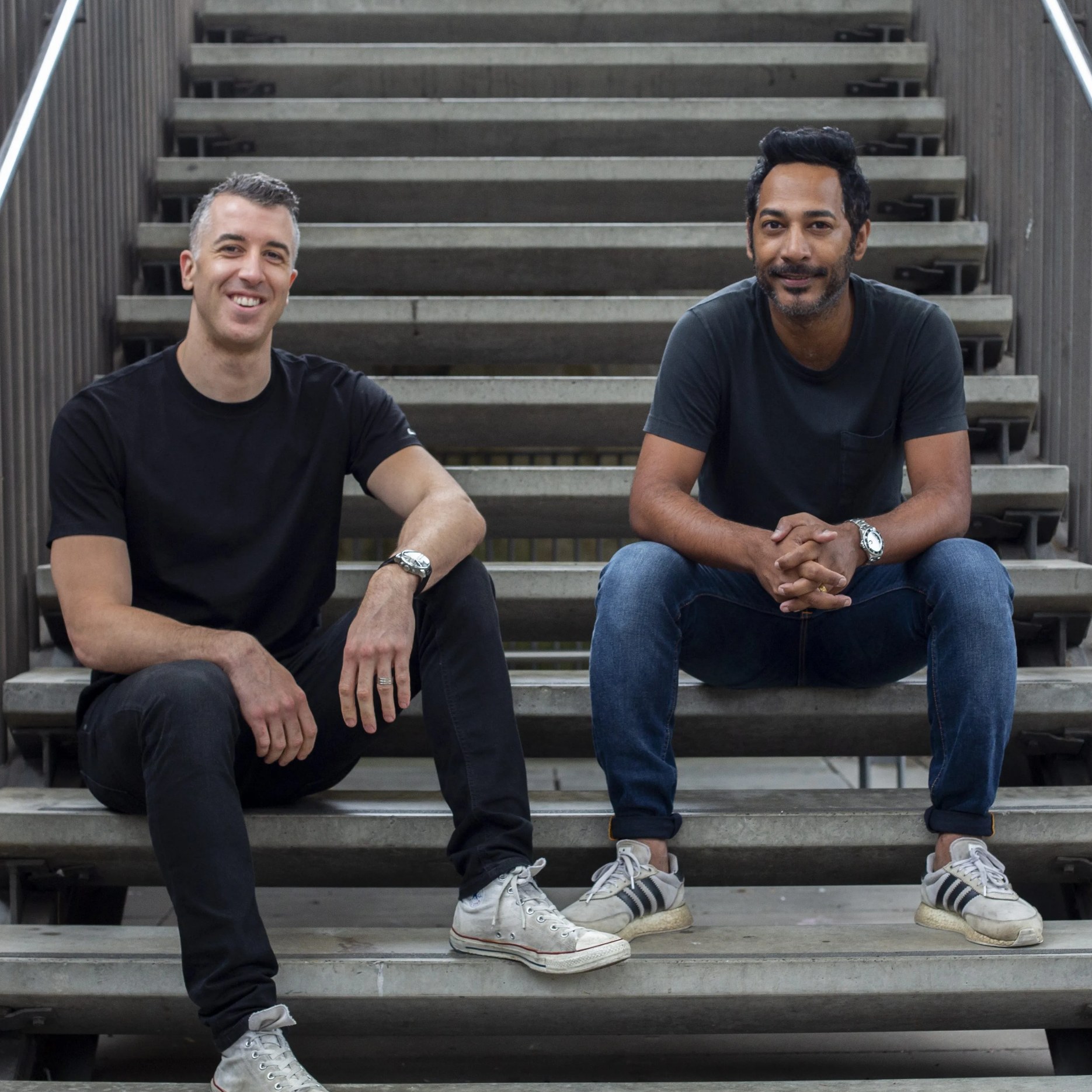 Livewire co-founders Brad Manuel and Indy Khabra seated on steps