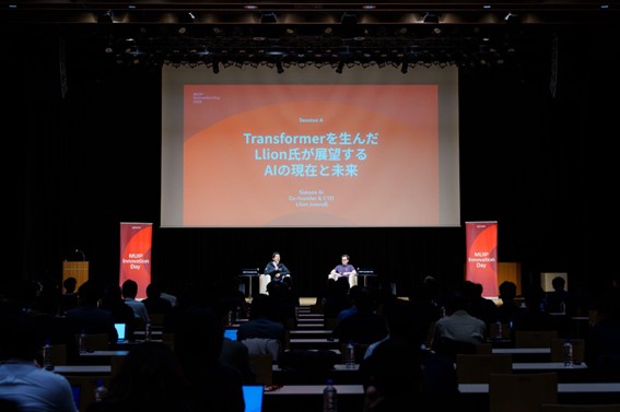 Llion Jones speaking on stage during MUIP Innovation Day 2026 in Japan