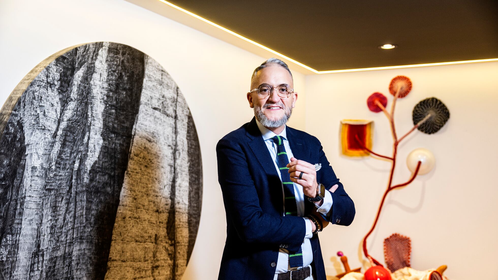LLYC chief executive Alejandro Romero standing in the firm's Madrid office