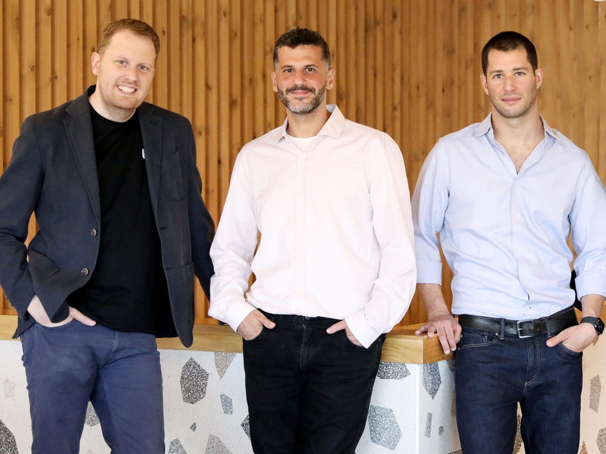 Three Localize leaders standing together in an office
