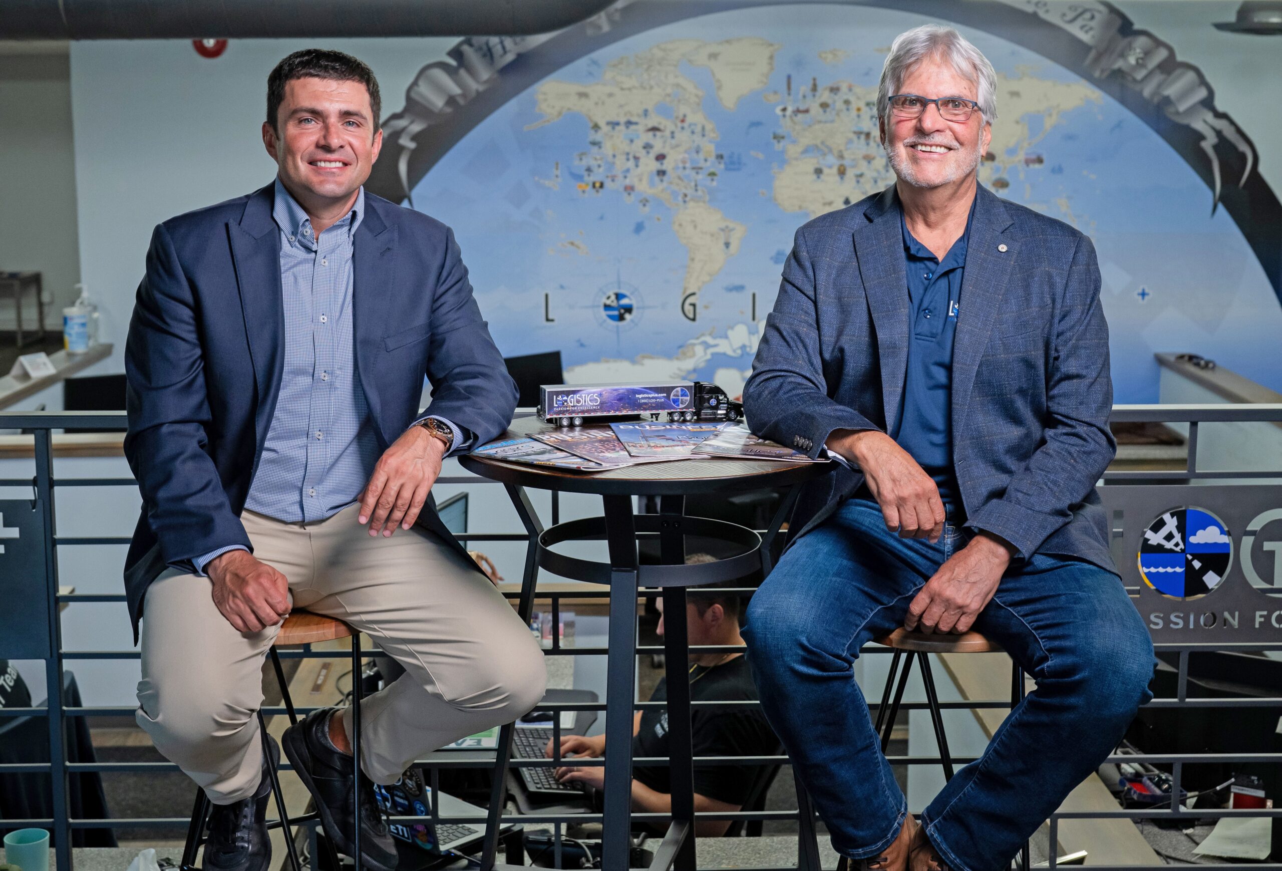 Yuriy Ostapyak and Jim Berlin seated in the Logistics Plus office