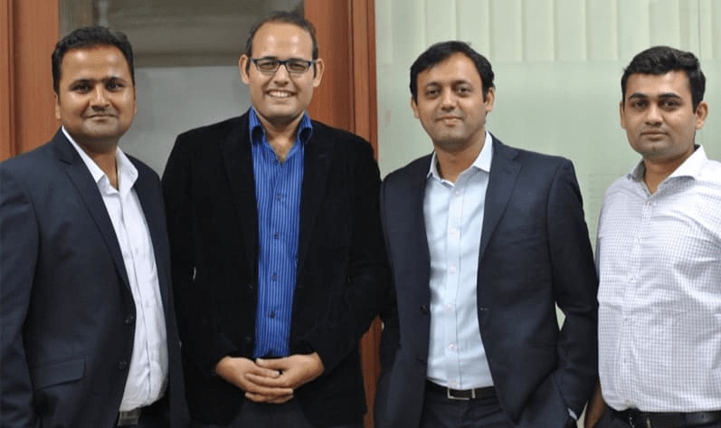WoodenStreet’s four co-founders standing together in an office