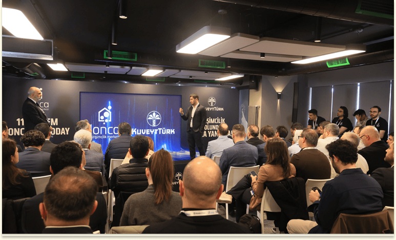 Speakers and a seated audience at Lonca’s 11th-cohort Demo Day