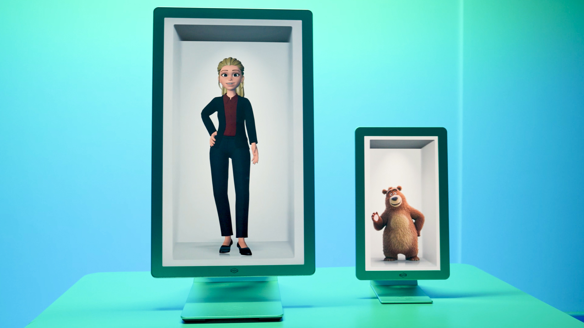 Two Looking Glass HLD displays showing an animated woman and a waving bear