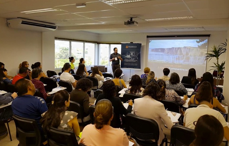 Lorhan Caproni speaking to seated nonprofit leaders at a Phomenta event