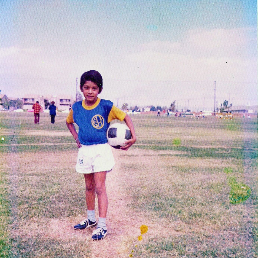 Louis Hernandez Jr. as a child in a soccer uniform