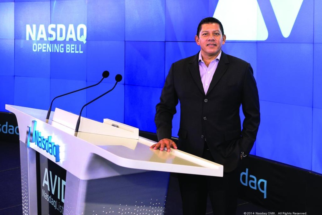 Louis Hernandez Jr. at the Nasdaq opening bell podium during his Avid tenure