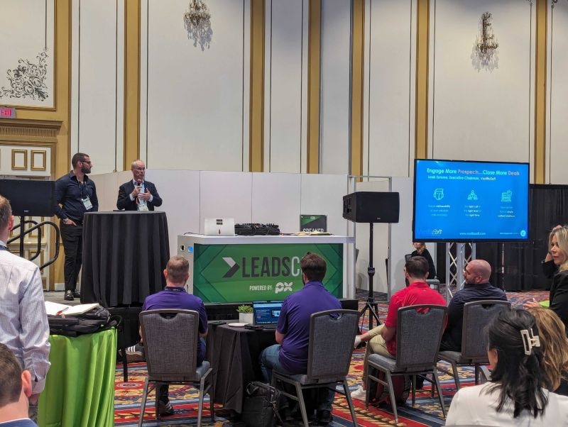 Louis Summe speaking alongside Seth Dorne at a VanillaSoft presentation at LeadsCon 2024