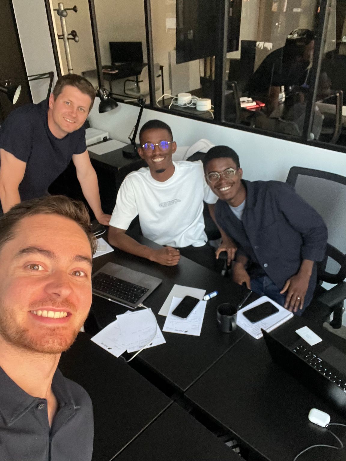 Luca Martial taking a group selfie with Kaelio and Flott founders in a Paris office