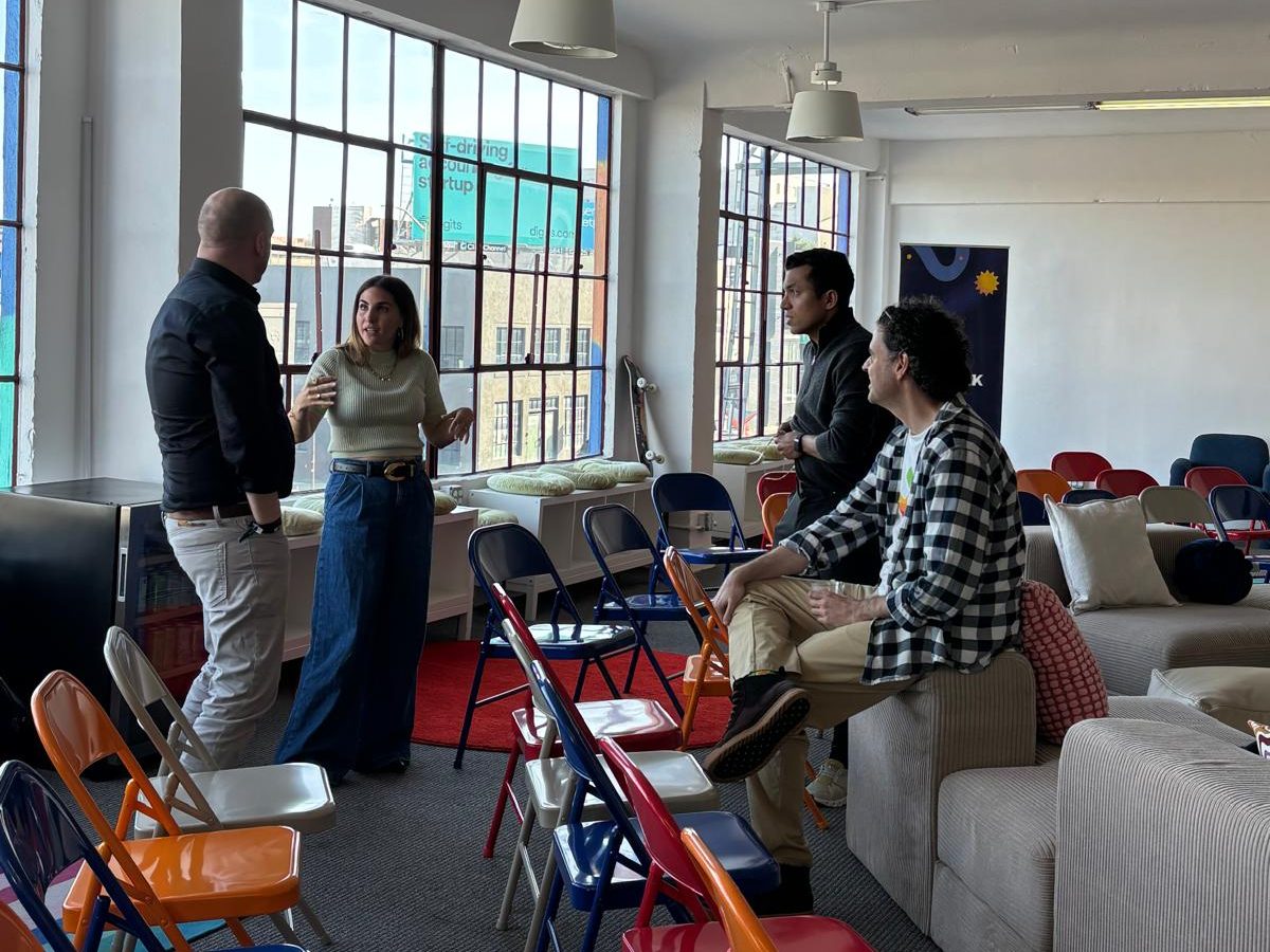 Luis Hernández Garrido seated at a gathering with other participants at Freepik’s San Francisco office
