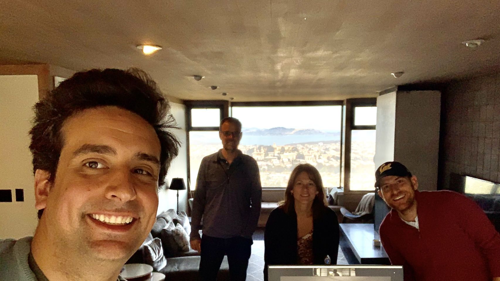 Luis Pino with members of the Agentero team in a casual office photograph
