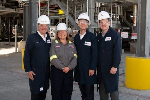 Four Stepan colleagues in hard hats at the Pasadena facility