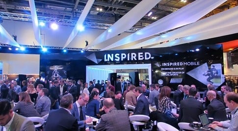 Visitors meeting at Inspired's busy exhibition stand at ICE 2016
