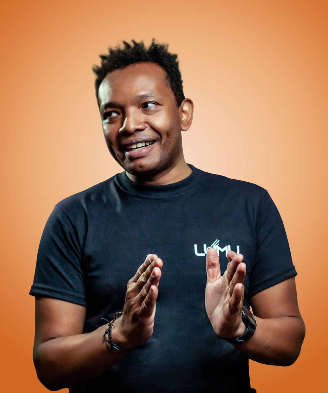 Lumu founder and CEO Ricardo Villadiego against an orange background