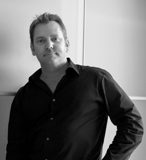 Black-and-white portrait of Luxury Brand Group founder Frank Proctor