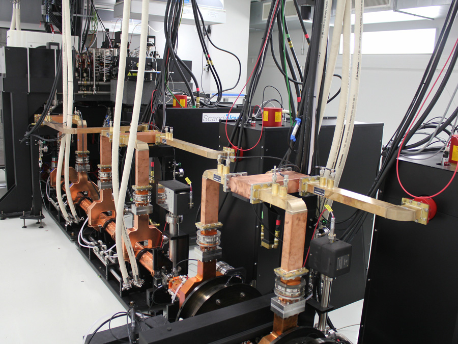 Copper accelerator components and cooling lines inside the Munich Compact Light Source