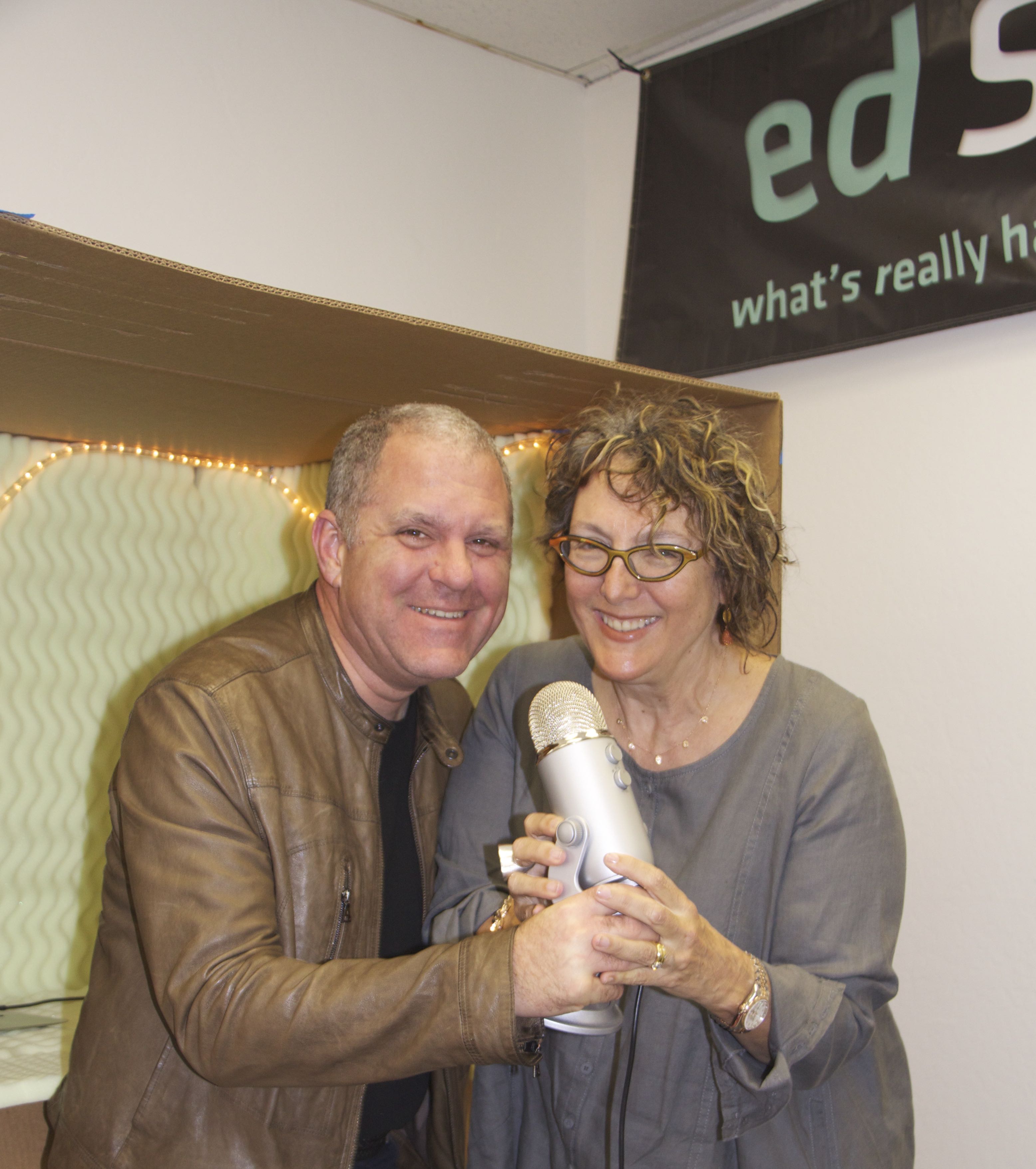Bruce Heavin and Lynda Weinman holding a microphone together at EdSurge in 2015