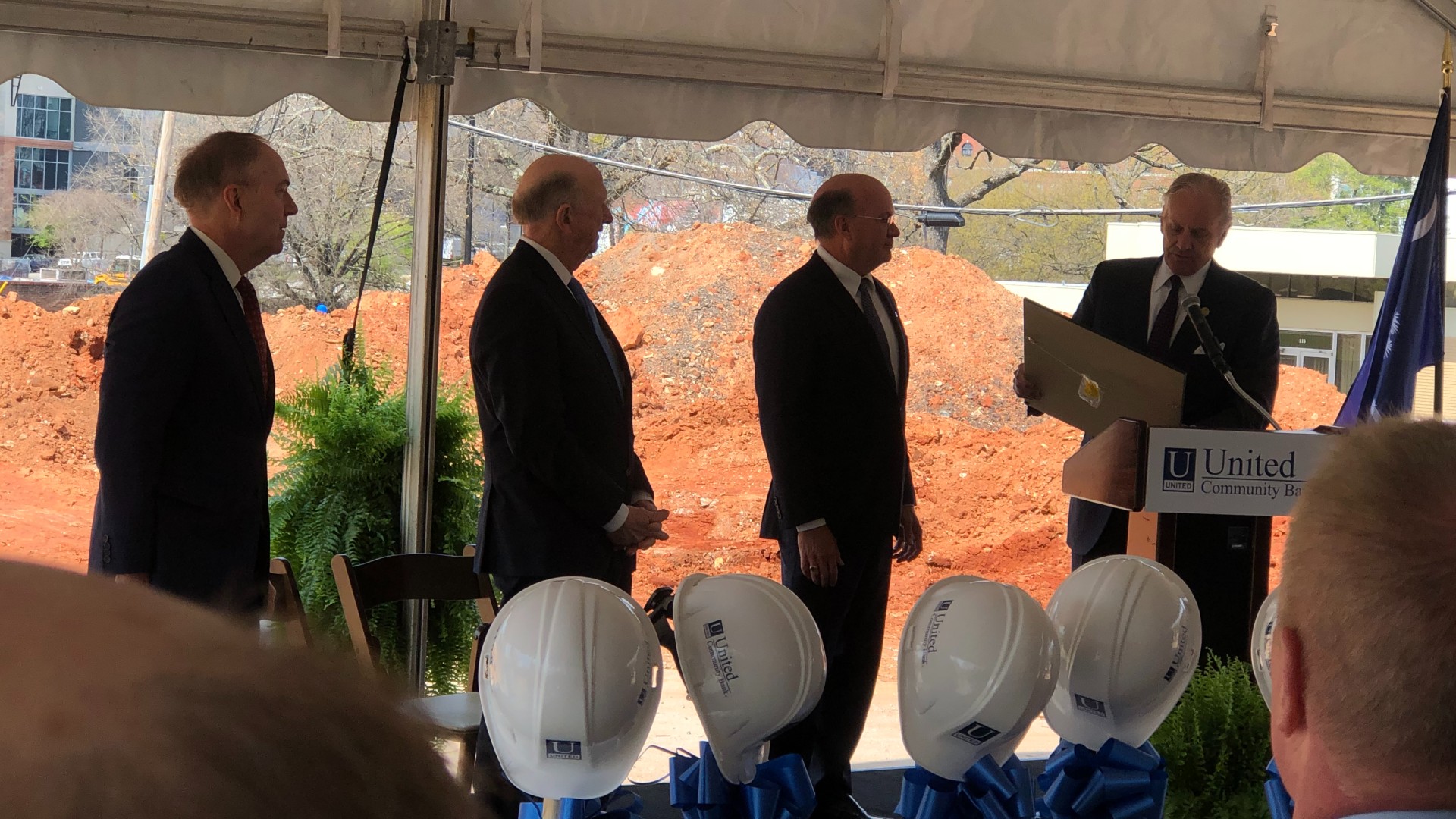 Lynn Harton, second from right, receives the Order of the Palmetto from Governor Henry McMaster at the 2022 headquarters groundbreaking.
