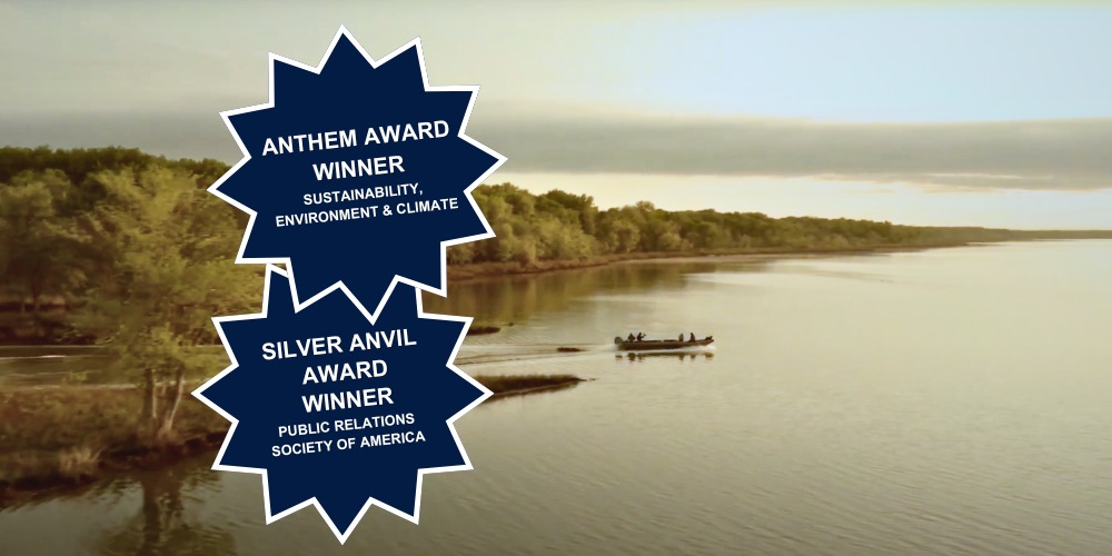 Copi campaign image showing a Midwest waterway with award badges